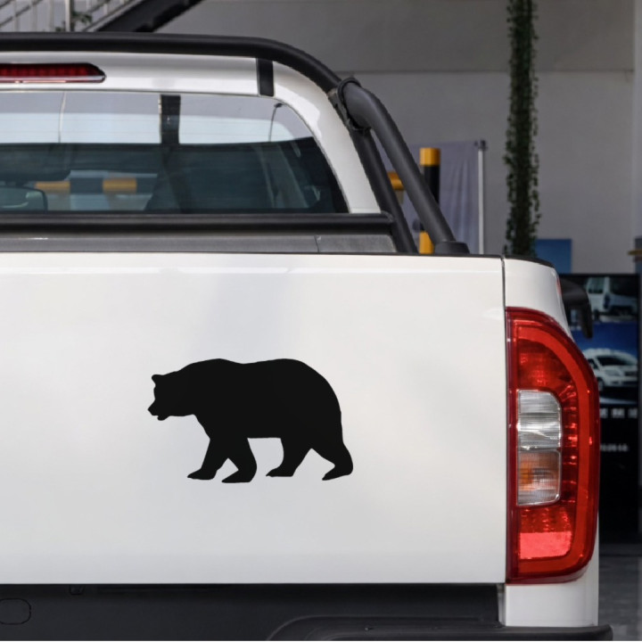 Alert Brown Bear sticker on a pickup tailgate