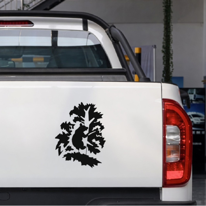 Bear Cub in a Leafy Tree sticker on a pickup tailgate