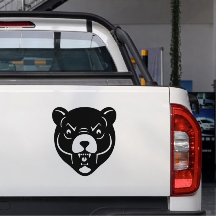Fanged Bear Face sticker on a pickup tailgate