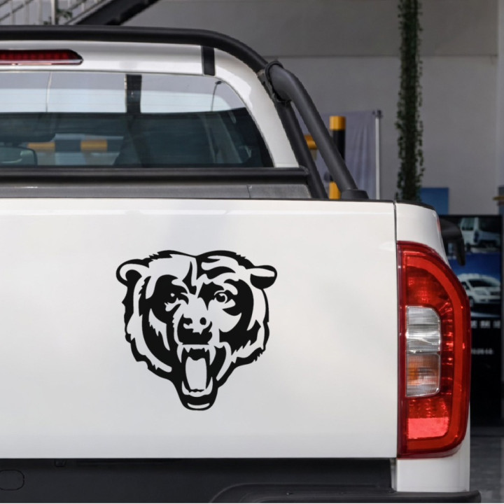Roaring Bear Head sticker on a pickup tailgate