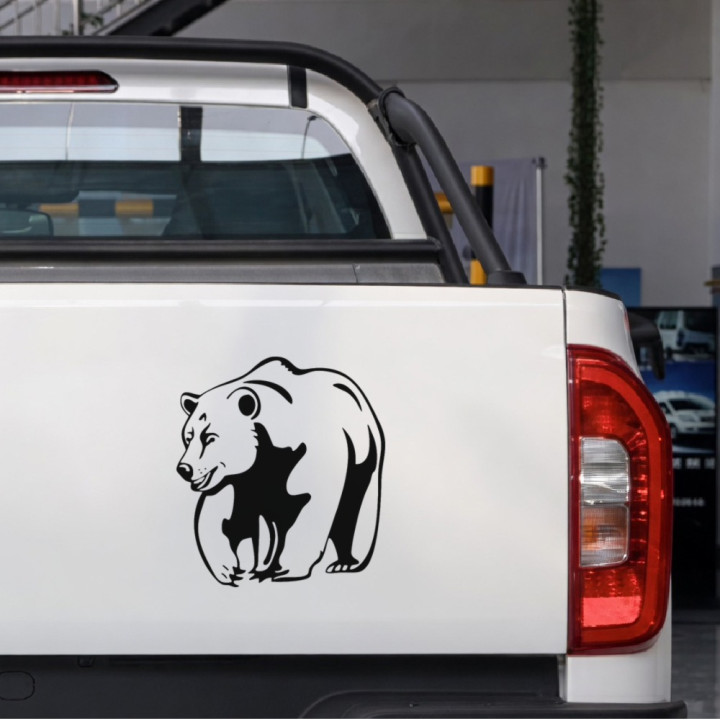 Smiling Grizzly sticker on a pickup tailgate