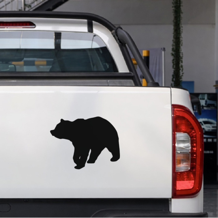 Walking Bear sticker on a pickup tailgate